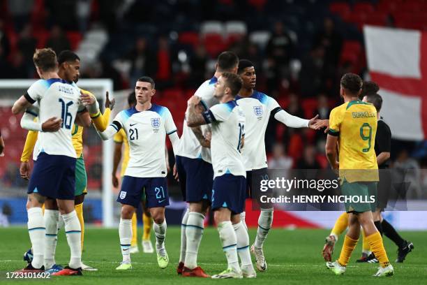 England players celebrate their win on the pitch after the international friendly football match between England and Australia at Wembley stadium in...