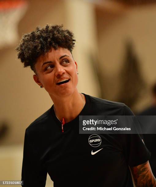 Assistant Coach Candice Dupree of the San Antonio Spurs smiles during an all access practice on October 11, 2023 at the Frost Bank Center in San...