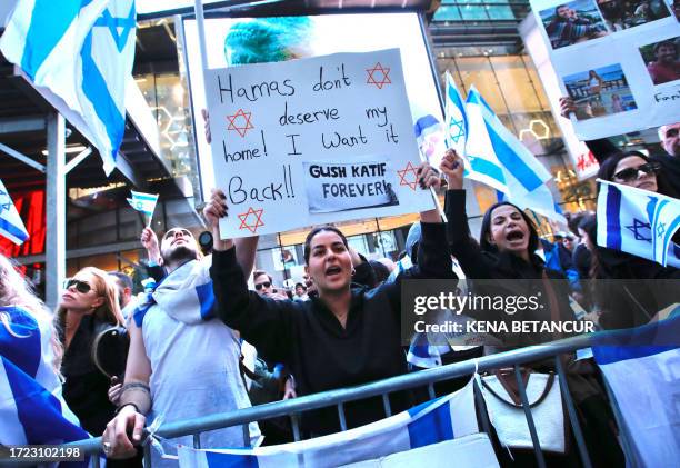 Supporters of Israel protest in Times Square, New York on October 13, 2023. Thousands of Palestinians fled to southern Gaza in search of refuge...