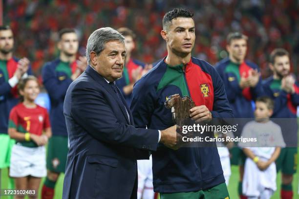 Portuguese Football Federation president Fernando Gomes gives Cristiano Ronaldo 200 caps award during the UEFA EURO 2024 European qualifier match...