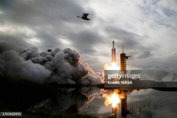 In this handout provided by NASA, a SpaceX Falcon Heavy rocket with the Psyche spacecraft onboard is launched from Launch Complex 39A, October 13,...