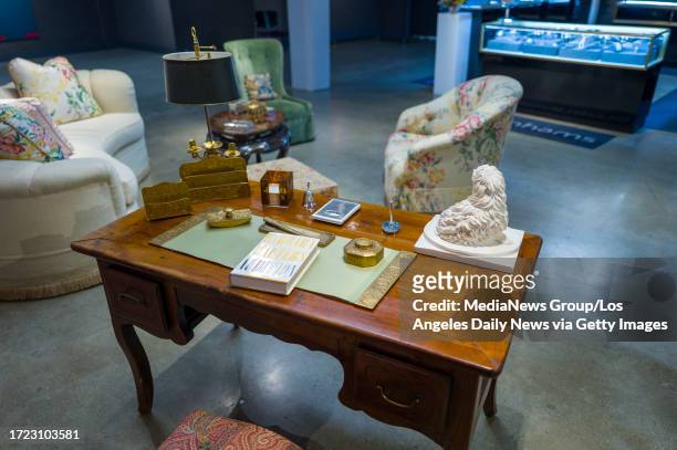 Los Angeles, CA Barbara Walters' personal desk on display during a preview of Barbara Walters' collection of jewelry, art and decorative objects at...