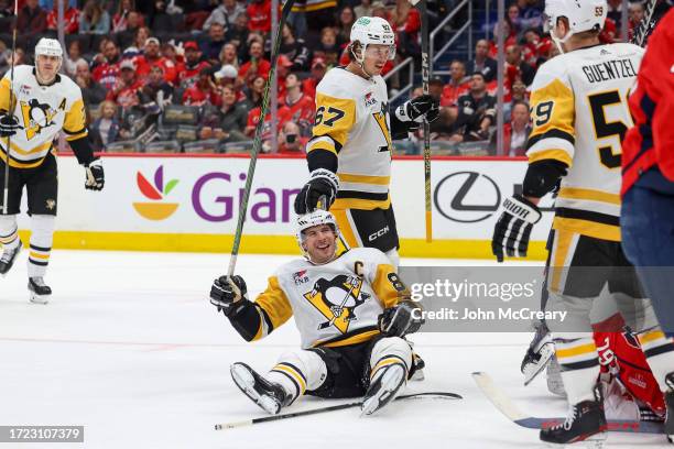 Sidney Crosby of the Pittsburgh Penguins celebrates a goal against the Washington Capitals at Capital One Arena on October 13, 2023 in Washington,...