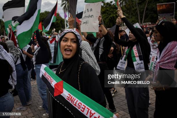 People attend a rally in support of Palestinians in the Gaza Strip at Bayfront Park in Miami, Florida, on October 13, 2023. Thousands of Palestinians...