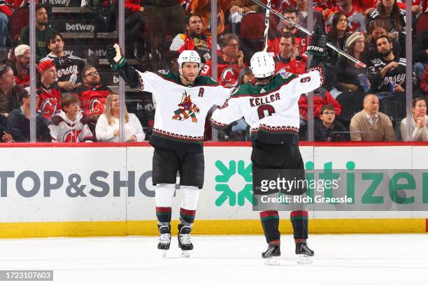Nick Schmaltz of the Arizona Coyotes celebrates his goal with Clayton Keller of the Arizona Coyotes in the third period of the game against the New...