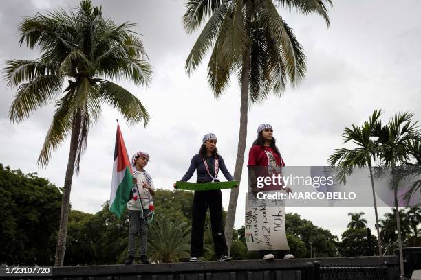 People attend a rally in support of Palestinians in the Gaza Strip at Bayfront Park in Miami, Florida, on October 13, 2023. Thousands of Palestinians...