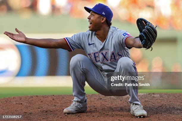 Jose Leclerc of the Texas Rangers reacts after the final out during the ninth inning of Game One of the American League Division Series against the...