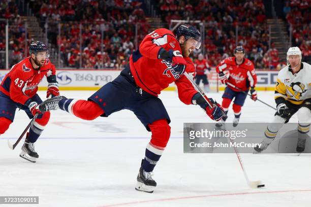 Anthony Mantha of the Washington Capitals takes a shot on goal during a game against the Pittsburgh Penguins at Capital One Arena on October 13, 2023...