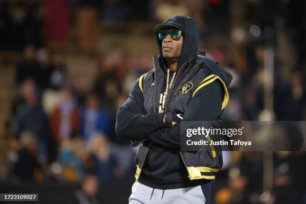 Head coach Deion Sanders of the Colorado Buffaloes watches his team during warm-ups before taking on the Stanford Cardinal at Folsom Field on October...