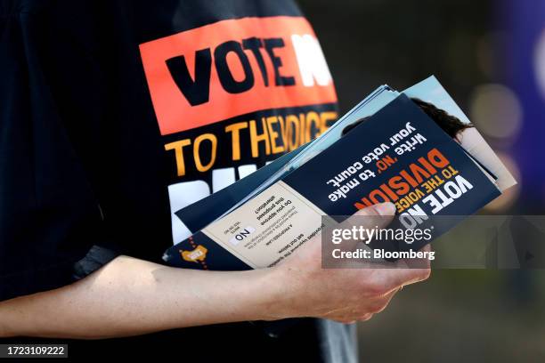 Volunteer holds voting material at a polling location during the Indigenous Voice to Parliament referendum in Sydney, Australia, on Saturday, Oct....