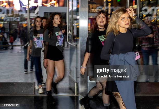 Taylor Swift fans arrive to attend the Taylor Swift concert movie at the AMC theater on October 13, 2023 in Century City, California.