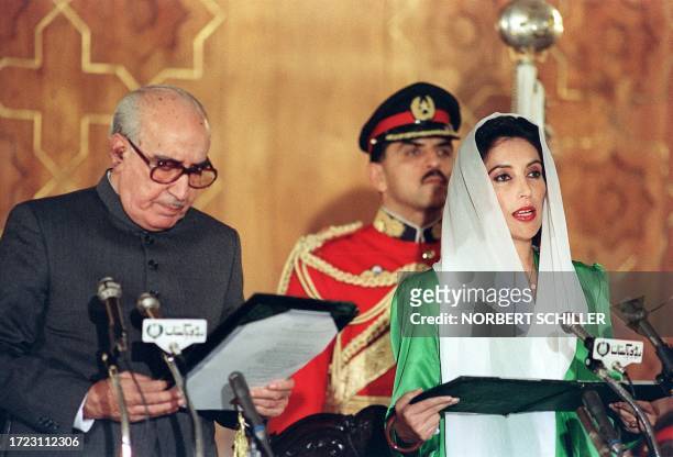 Pakistan People's Party leader Benazir Bhutto takes oath as Prime Minister of Pakistan near President Ghulam Ishaq Khan at the parliament building in...