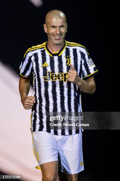 Zinedine Zidane smiles as he enters the pitch during the'Together, a Black & White Show' event organized by Juventus FC as part of the celebrations...
