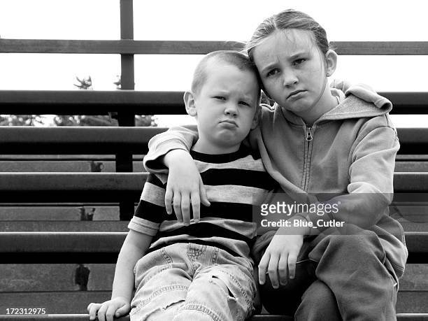 kids on the bleachers - orphan boy stock pictures, royalty-free photos & images