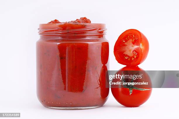 tomato sauce in a container - tomatensaus stockfoto's en -beelden