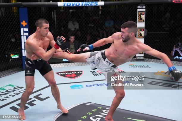 Bill Algeo kicks Alexander Hernandez in a featherweight fight during the UFC Fight Night weigh-in at UFC APEX on October 07, 2023 in Las Vegas,...