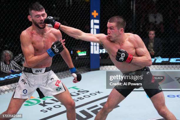 Alexander Hernandez punches Bill Algeo in a featherweight fight during the UFC Fight Night weigh-in at UFC APEX on October 07, 2023 in Las Vegas,...