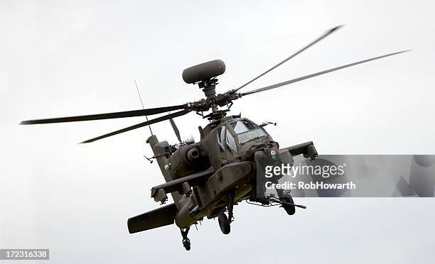 large military helicopter in flight - apache helikopter stockfoto's en -beelden