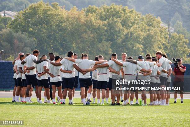 England's team players huddle as they take part during the captain's run training session at the stade Georges-Carcassonne in Aix-en-Provence...