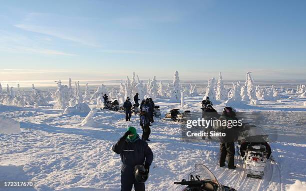 snowscooter trip - snow vehicle stock pictures, royalty-free photos & images