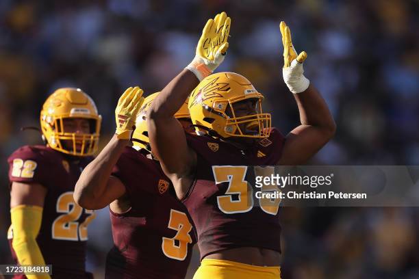 Defensive lineman B.J. Green II of the Arizona State Sun Devils celebrates after a sack against the Colorado Buffaloes during the first half of the...