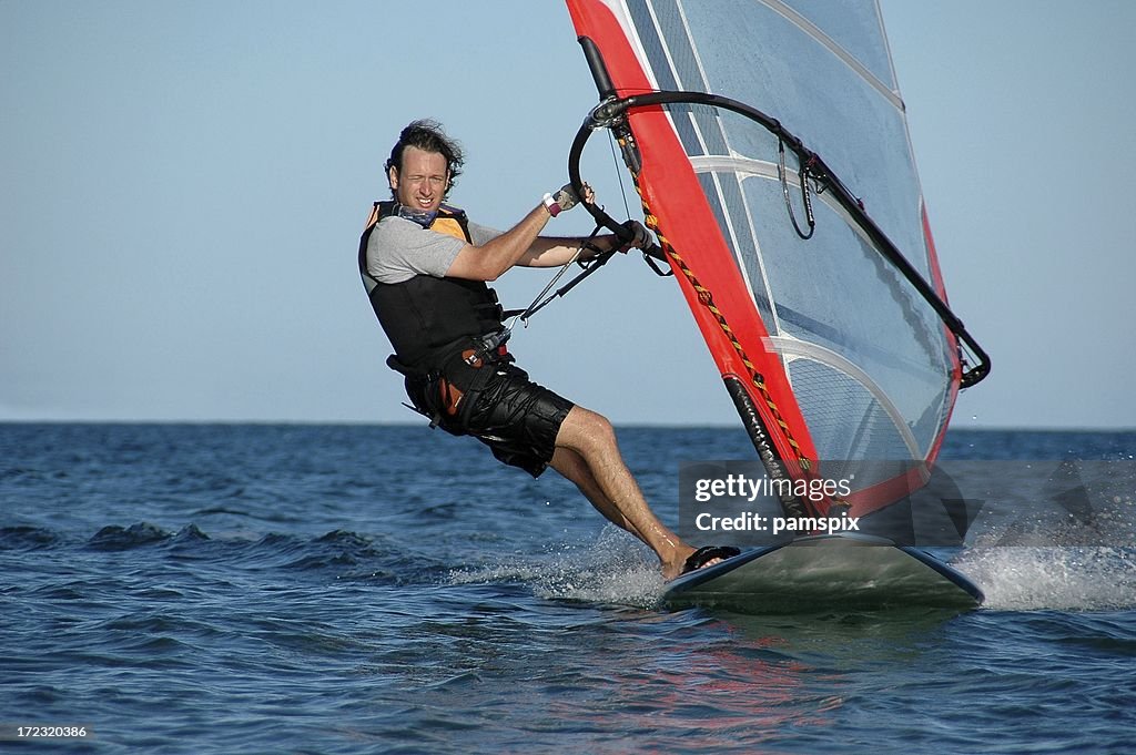 Man Windsurfing and having Fun!!