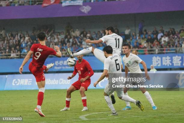 Otabek Jurakuziyev of Team Uzbekistan saves a shot from Matthew Elliot Wing Kai Chin Orr of Team Chinese Hong Kong in the Football - Men's Bronze...