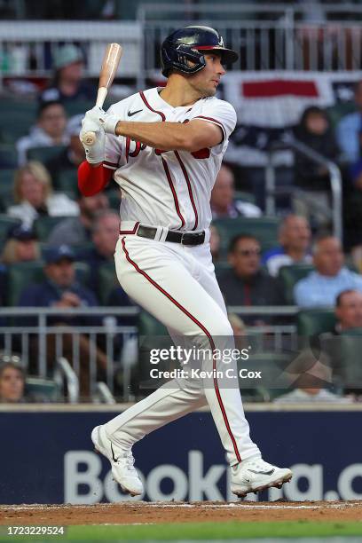 Matt Olson of the Atlanta Braves hits a single during the fourth inning against the Philadelphia Phillies during Game One of the Division Series at...