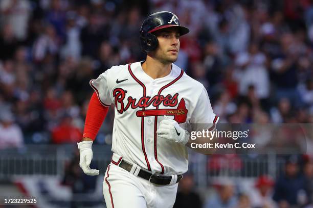 Matt Olson of the Atlanta Braves hits a single during the fourth inning against the Philadelphia Phillies during Game One of the Division Series at...