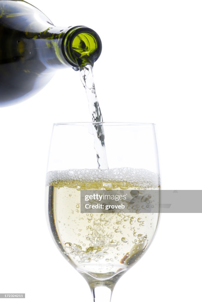Pouring a glass of white wine w/clipping path