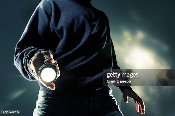 man with torch at night - flashlight stockfoto's en -beelden