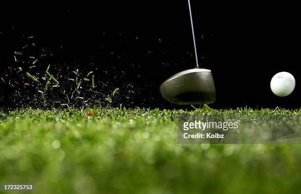 golf ball struck by driver with black background - golfboll bildbanksfoton och bilder