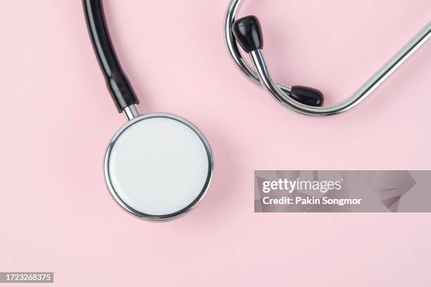 stethoscopes against a pink background. - stethoskop stock-fotos und bilder