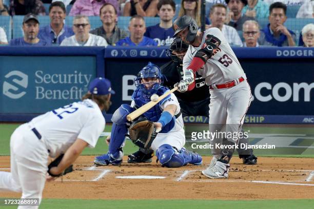 Christian Walker of the Arizona Diamondbacks hits a double off Clayton Kershaw of the Los Angeles Dodgers in the first inning during Game One of the...