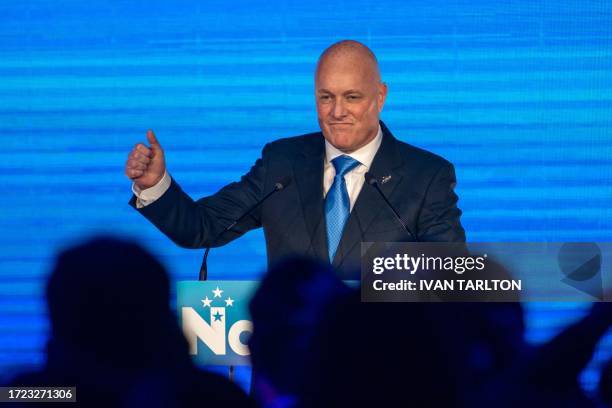 New Zealand's National Party leader Christopher Luxon reacts while being applauded by his supporters after winning the 2023 New Zealand general...