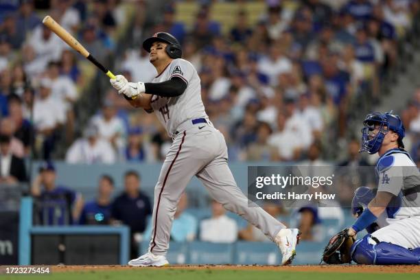 Gabriel Moreno of the Arizona Diamondbacks hits a home run in the first inning against the Los Angeles Dodgers during Game One of the Division Series...