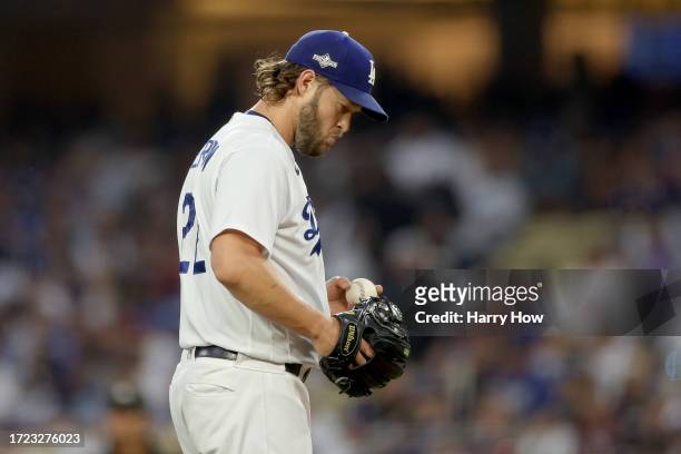 Clayton Kershaw of the Los Angeles Dodgers reacts in the first inning against the Arizona Diamondbacks during Game One of the Division Series at...