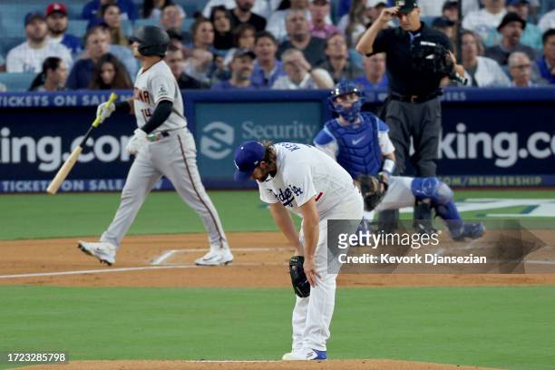 Clayton Kershaw of the Los Angeles Dodgers reacts after giving up a home run to Gabriel Moreno of the Arizona Diamondbacks in the first inning during...