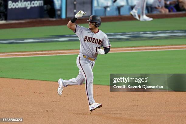 Gabriel Moreno of the Arizona Diamondbacks rounds the bases after hitting a home run in the first inning against the Los Angeles Dodgers during Game...
