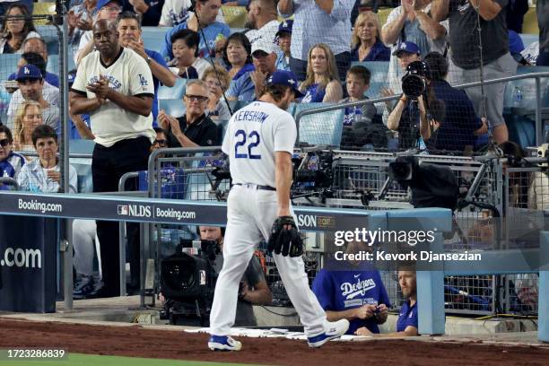 Magic Johnson looks on as Clayton Kershaw of the Los Angeles Dodgers walks off the field after being relieved in the first inning against the Arizona...