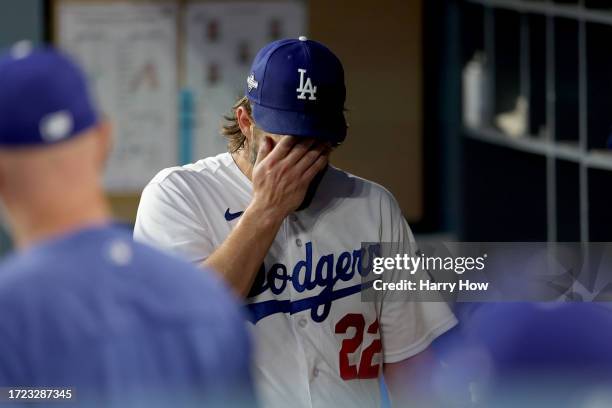 Clayton Kershaw of the Los Angeles Dodgers walks through the dugout after being relieved in the first inning against the Arizona Diamondbacks during...
