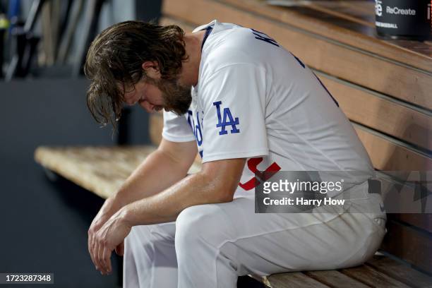 Clayton Kershaw of the Los Angeles Dodgers sits in the dugout after being relieved in the first inning against the Arizona Diamondbacks during Game...