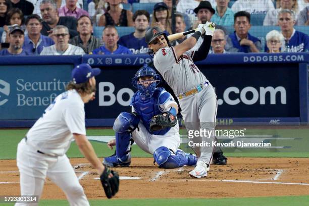 Gabriel Moreno of the Arizona Diamondbacks hits a home run off Clayton Kershaw of the Los Angeles Dodgers in the first inning during Game One of the...