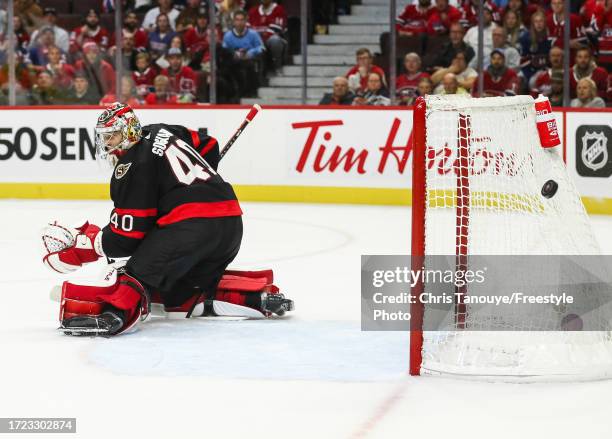 Mads Sogaard of the Ottawa Senators looks on as Arber Xhekaj of the Montreal Canadiens scores in the third period of a preseason game at Canadian...