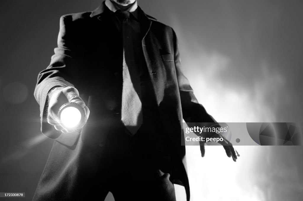 Black And White Man in Suit With Torch