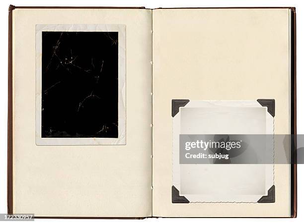 a vintage photo album with photo corners holding photos - photo album 個照片及圖片檔