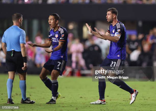 Yuya Kubo and Matt Miazga of FC Cincinnati speak to the official in the match against Inter Miami CF during the second half at DRV PNK Stadium on...