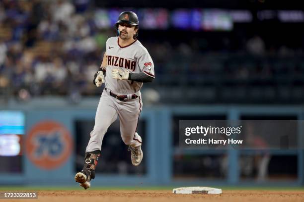 Corbin Carroll of the Arizona Diamondbacks rounds the bases after hitting a home run in the second inning against the Los Angeles Dodgers during Game...