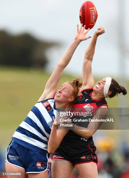 Aishling Moloney of the Cats and Danielle Marshall of the Bombers compete for the ball during the round six AFLW match between Essendon Bombers and...