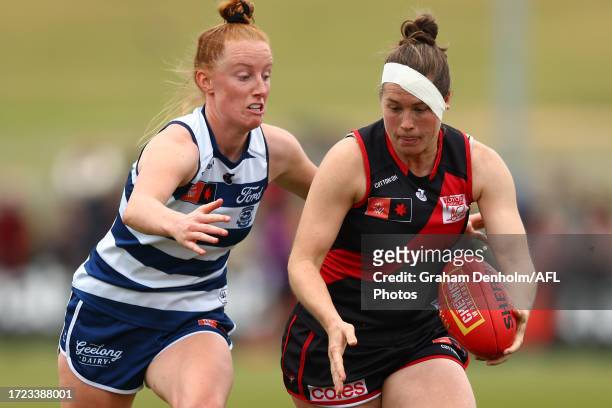 Aishling Moloney of the Cats tackles Danielle Marshall of the Bombers during the round six AFLW match between Essendon Bombers and Geelong Cats at...